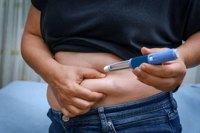 Patient and provider reviewing a GLP-1 weight loss safety and follow-up checklist in Eugene, OR.